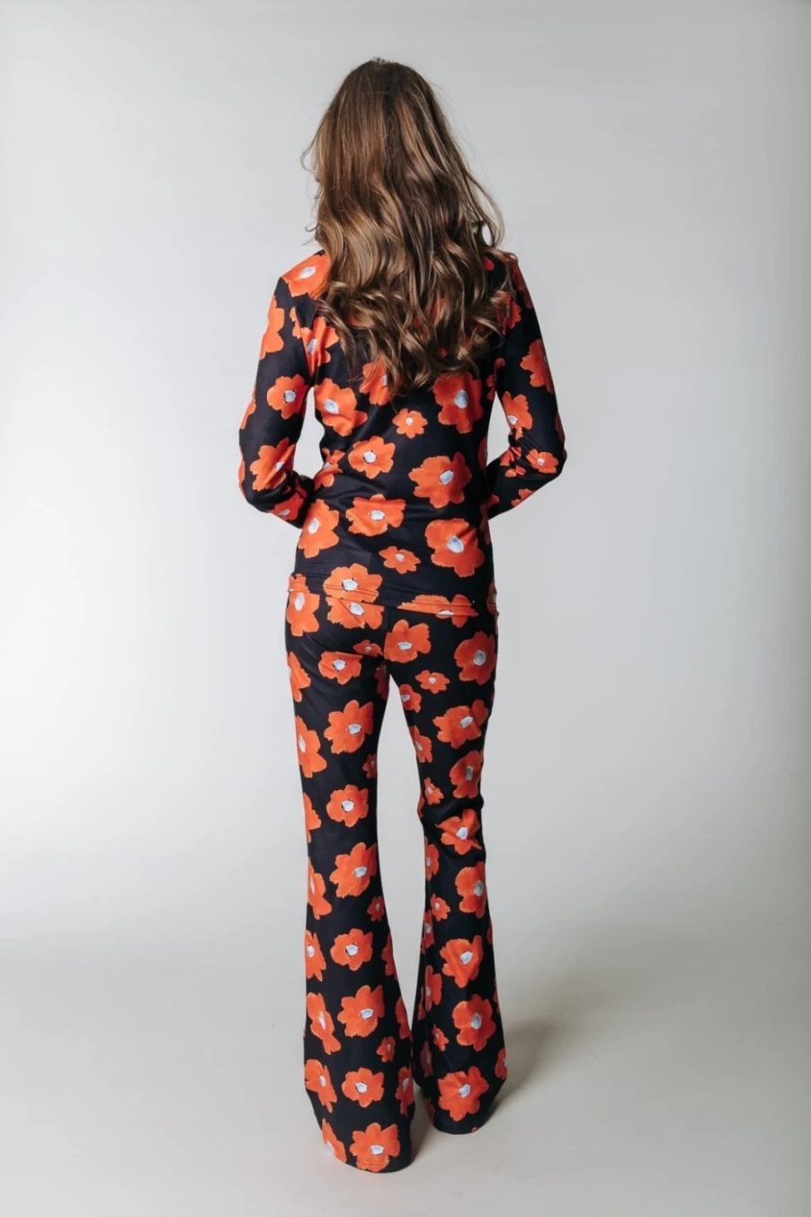 Colourful Rebel Women's Peach Flare Pants in Mandarin Orange - Floral Print High Waist Trousers