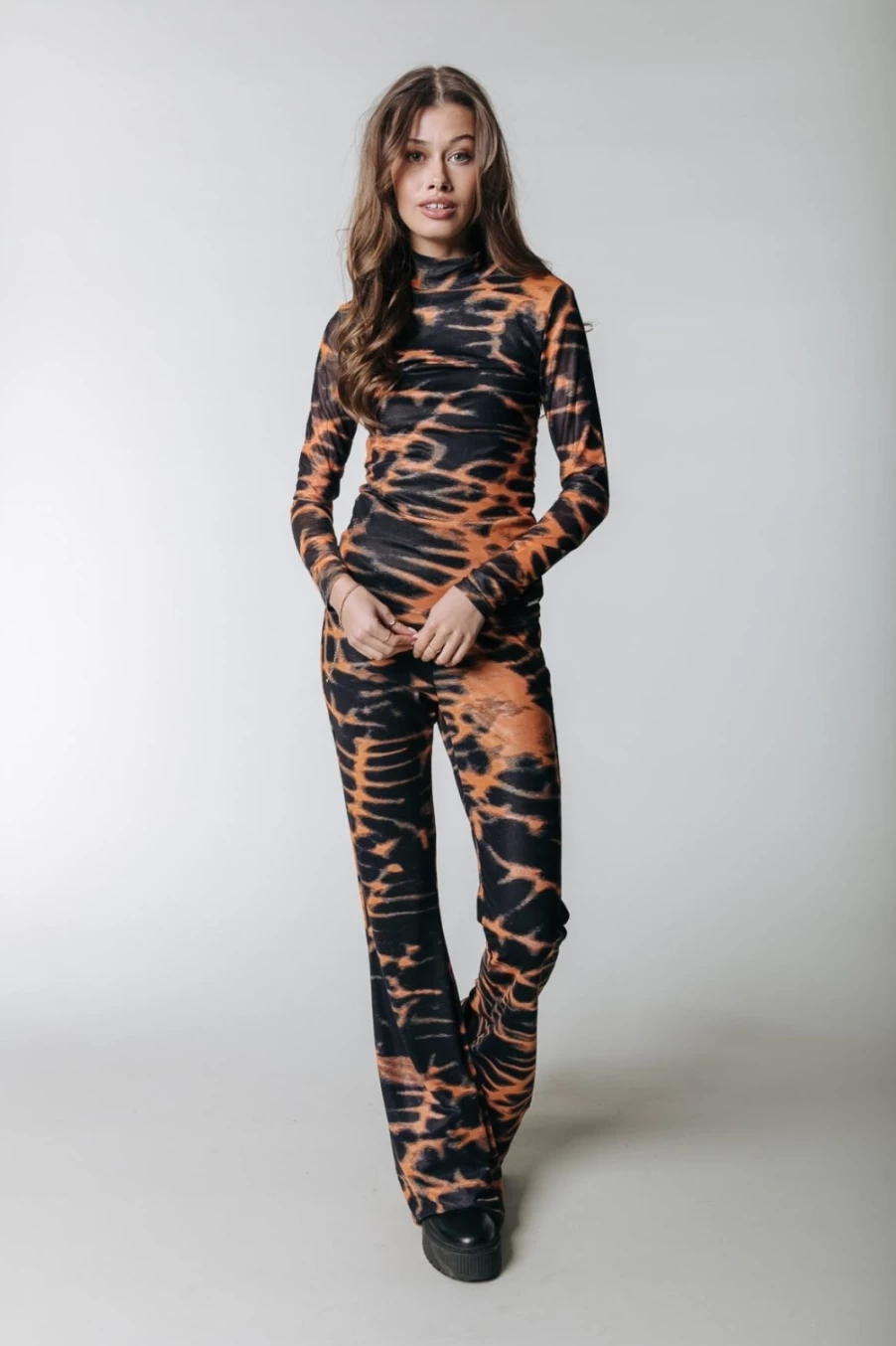 Colourful Rebel Women's Animal Print Mesh Flare Pants in Mandarin Orange