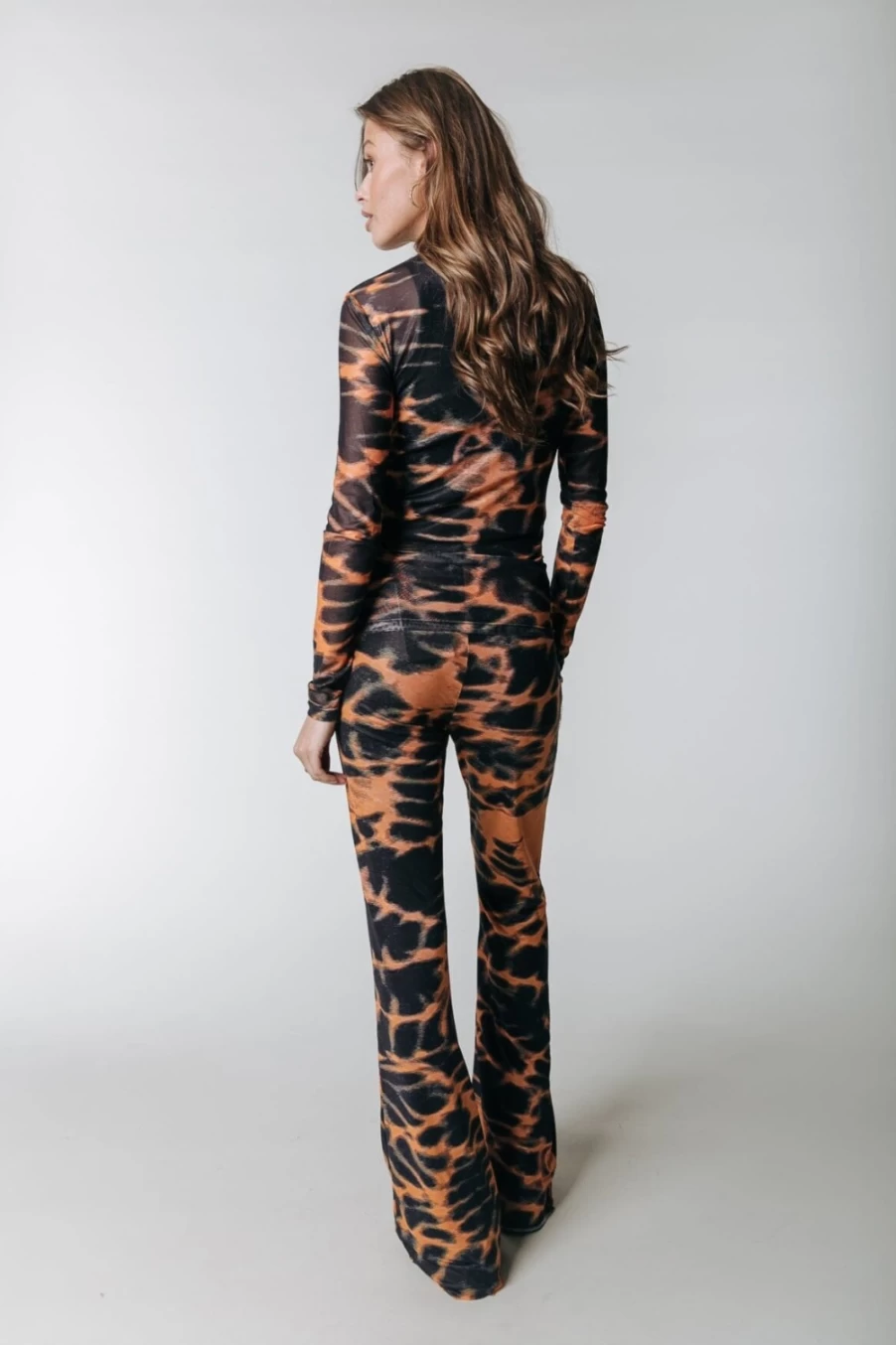Colourful Rebel Women's Animal Print Mesh Flare Pants in Mandarin Orange